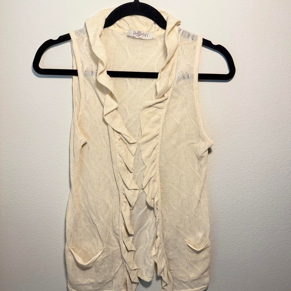 Cream ruffle vest with lace-like texture